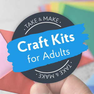 A gray circle with a blue banner that reads Craft Kits for Adults