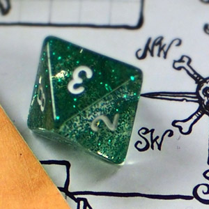 A green d8 die on a black and white map