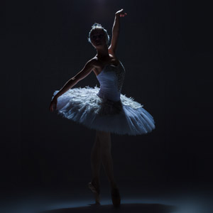 Ballet dancer on a dark stage