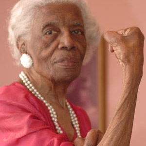 Birdia Bush, civil rights activist and WWII "invisible warrior," does the Rosie the Riveter pose