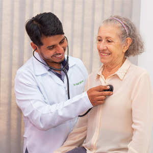 Doctor examining senior patient 