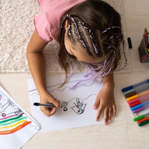 Child drawing with markers