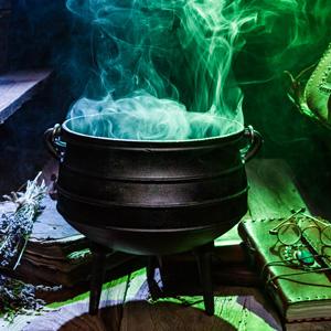 Cauldron with vapor pouring out, bathed in eerie light