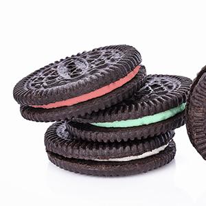 Chocolate sandwich cookies with different color fillings