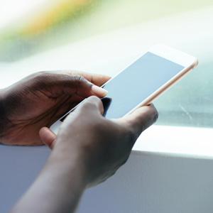 Closeup of hands using a smartphone