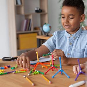 Child using magnetic building toys for exploratory play