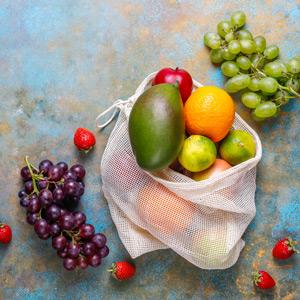 Mesh produce bag full of fresh fruits