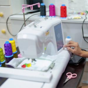 Embroidery machine stitching a design