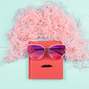 Book wearing a wig, sunglasses, and mustache