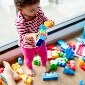 child with building blocks