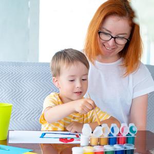 Parent and child collaborate on painting