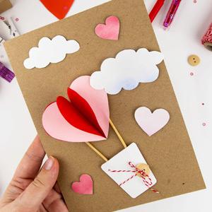 Paper valentines card decorated with a heart-shaped balloon