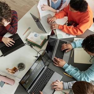 Teens studying at a table together