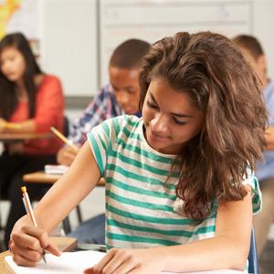 Teens taking a test in a classroom